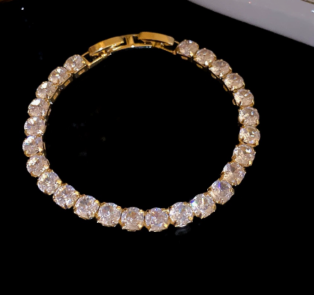 Round Stone Titanium Steel Tennis Bracelet, Gold Tone, Clear.