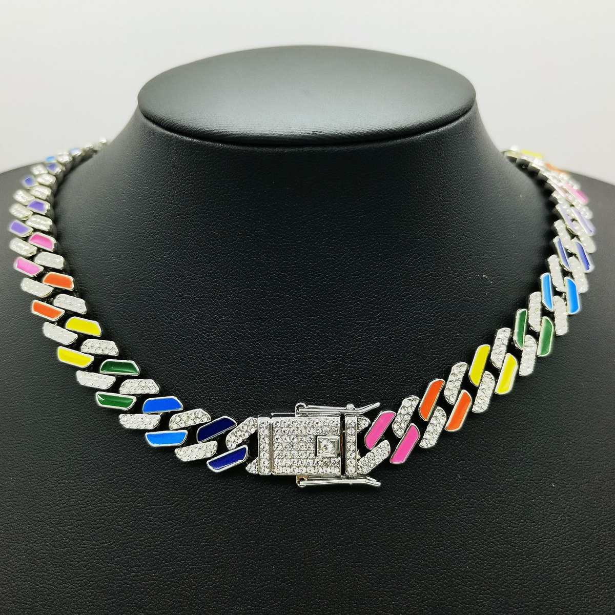Silver-tone rainbow Cuban-style chain with clear stone-set links and a square decorative clasp.