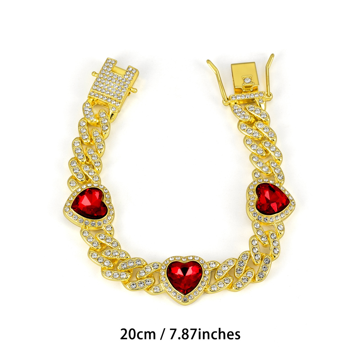 Gold Tone Cuban link bracelet with three deep red heart-shaped accents and a clasp; 20 cm.