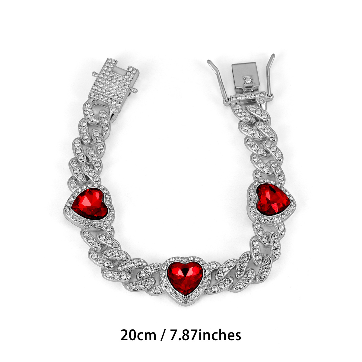Silver Tone Cuban link bracelet with three deep red heart-shaped accents and a clasp; 20 cm.