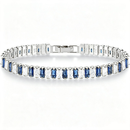Silver Tone tennis bracelet with alternating blue and clear rectangular stones and a clasp.