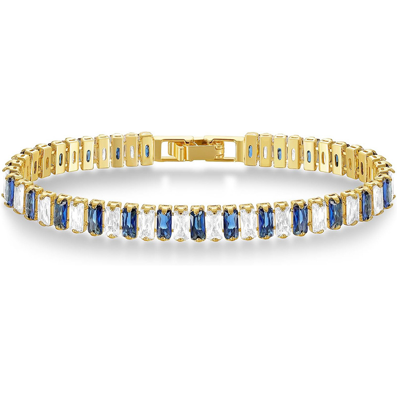 Gold Tone tennis bracelet with alternating blue and clear rectangular stones and a clasp.
