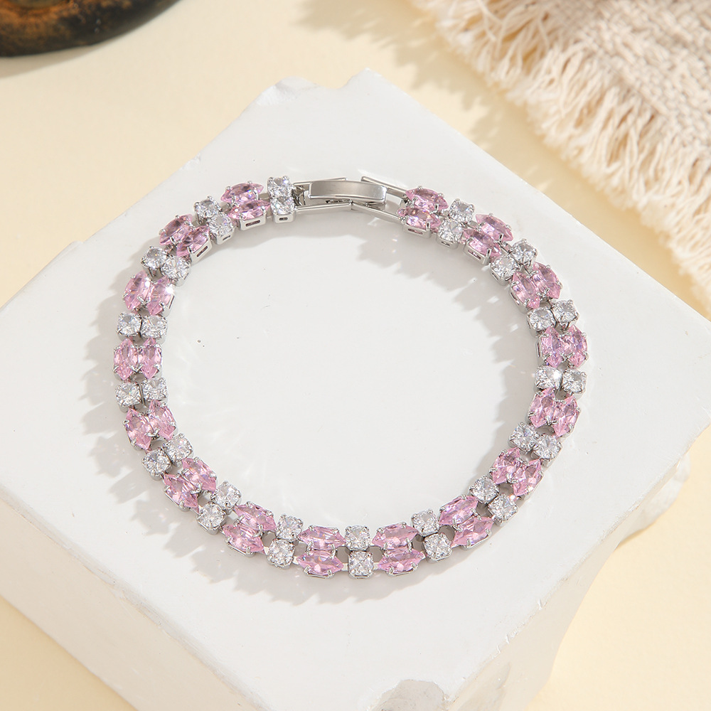 Silver-tone double-row bracelet in clear / pink with paired marquise-shaped stones and small round accents.