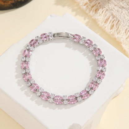 Silver-tone double-row bracelet in clear / pink with paired marquise-shaped stones and small round accents.