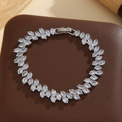 Silver-tone leaf-wreath bracelet in clear with angled marquise-shaped stones and a clasp.