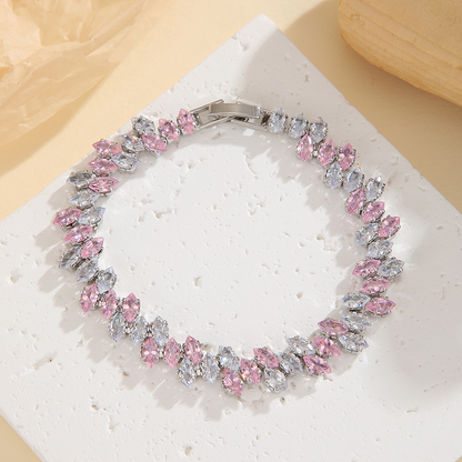 Silver-tone leaf-wreath bracelet in clear / pink with angled marquise-shaped stones and a clasp.