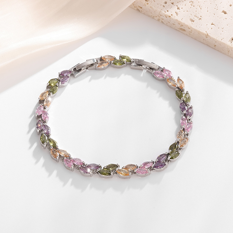 Silver-tone petite leaf bracelet with multicolor stone accents and a clasp.