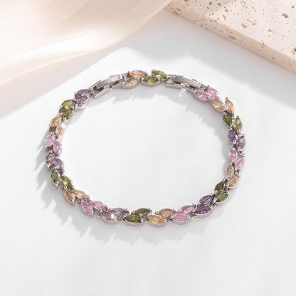 Silver-tone petite leaf bracelet with multicolor stone accents and a clasp.