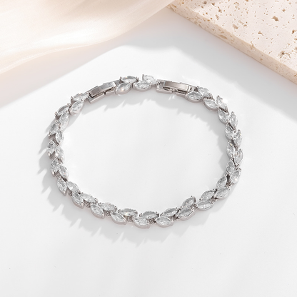 Silver-tone petite leaf bracelet with clear stone accents and a clasp.