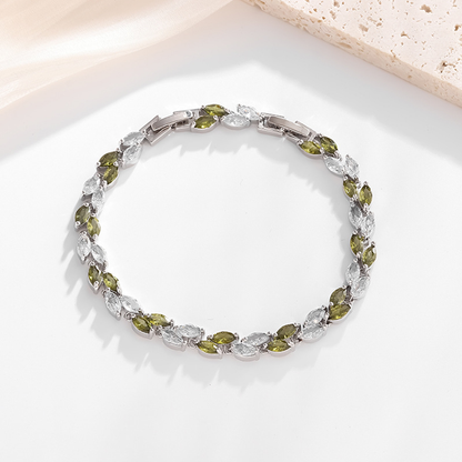 Silver-tone petite leaf bracelet with green stone accents and a clasp.