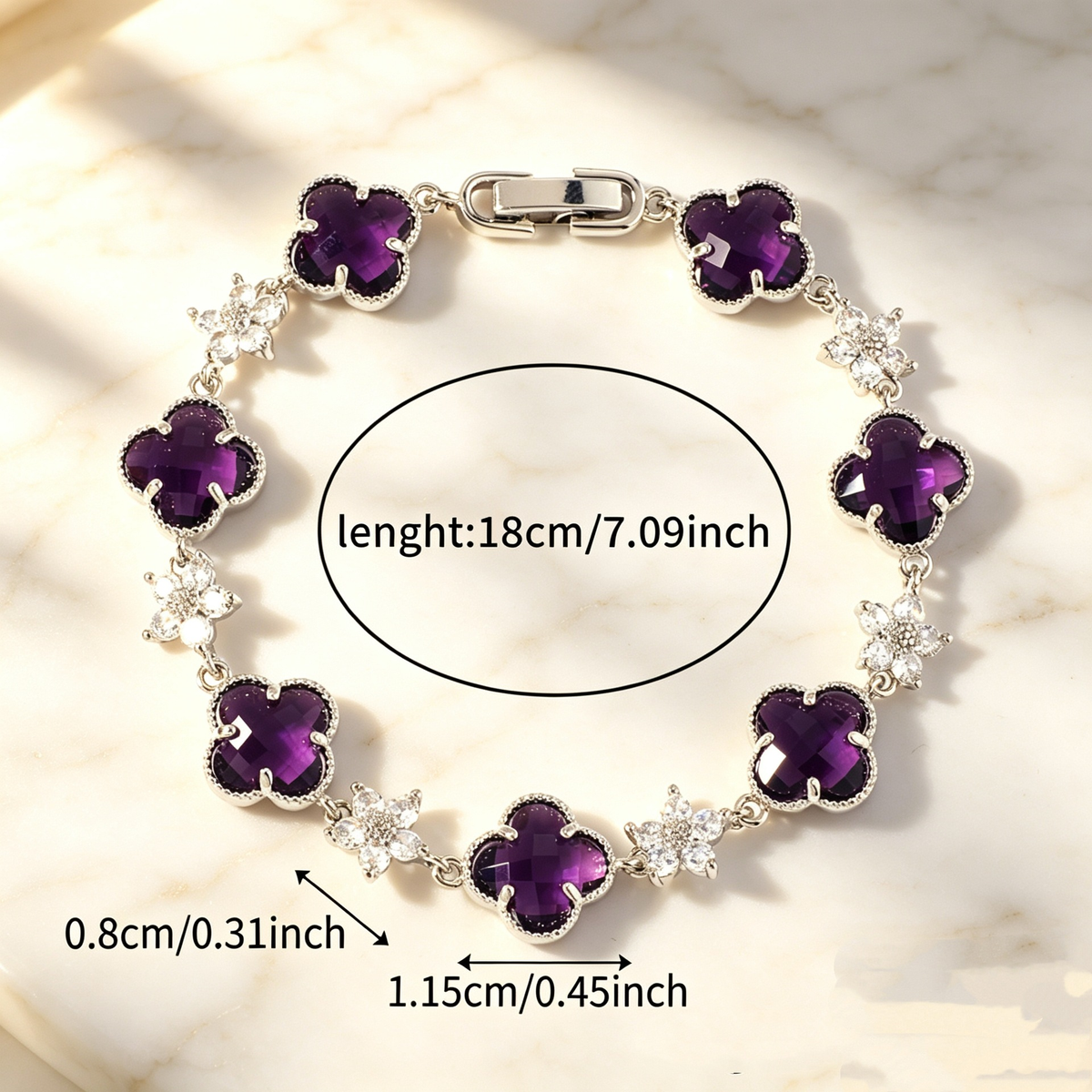 Silver Tone bracelet with purple four-leaf clovers and small clear flower links; length 18 cm.