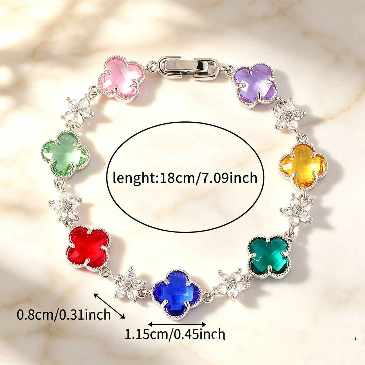Silver Tone bracelet with multicolor four-leaf clovers and small clear flower links; length 18 cm.