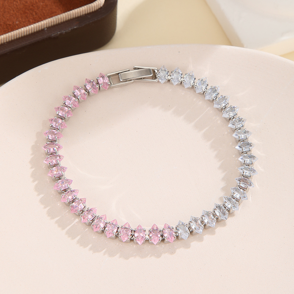 Silver-tone bracelet with separate clear / pink sections of marquise-shaped stones and a clasp.