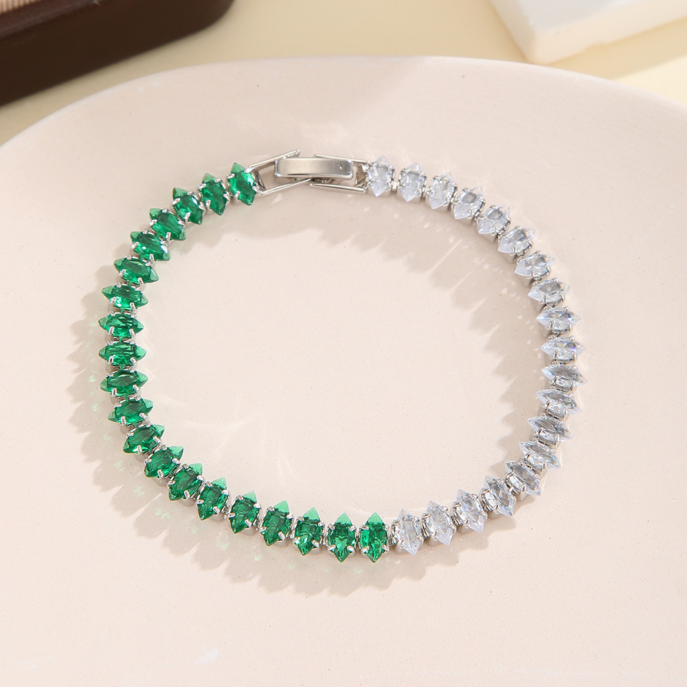 Silver-tone bracelet with separate clear / green sections of marquise-shaped stones and a clasp.