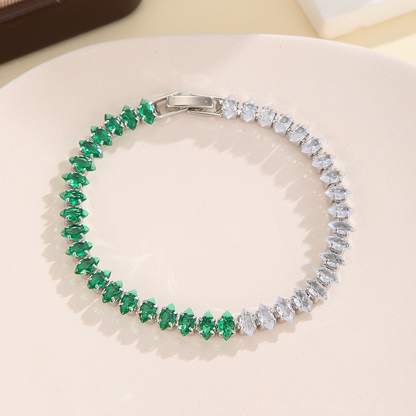 Silver-tone bracelet with separate clear / green sections of marquise-shaped stones and a clasp.