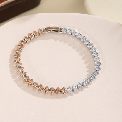 Silver-tone bracelet with separate clear / champagne sections of marquise-shaped stones and a clasp.