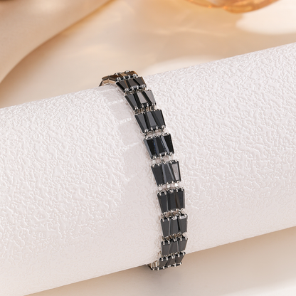 Silver-tone bracelet with three-stone geometric panels in the black arrangement.