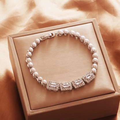 Silver Tone bracelet, style TSL005, with rectangular halo centers and rounded links and a clasp.