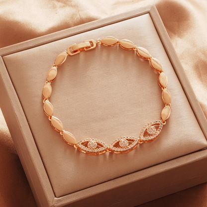 Gold Tone bracelet, style TSL008, with marquise halo centers and smooth oval links and a clasp.