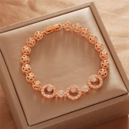 Gold Tone bracelet, style TSL030, with circular halo centers and open decorative round links and a clasp.
