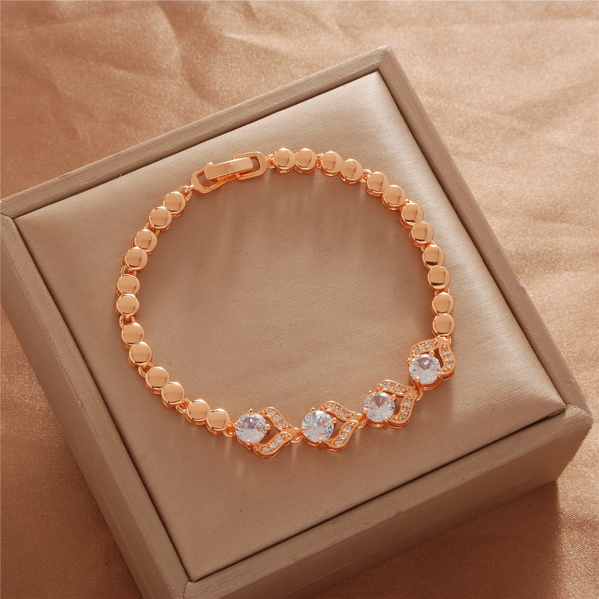 Gold Tone bracelet, style TSL031, with round and geometric center accents with rounded links and a clasp.