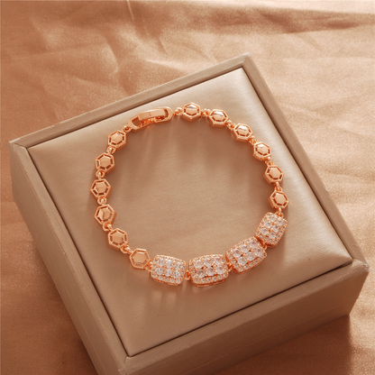 Gold Tone bracelet, style TSL037, with square stone-set center panels and open geometric links and a clasp.